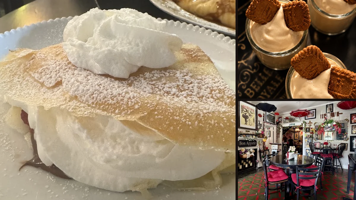 Coffee cups beside a sweet crêpe on a table.