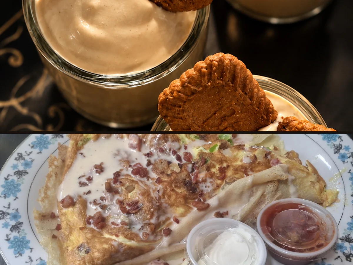 Coffee cups beside a sweet crêpe on a table.